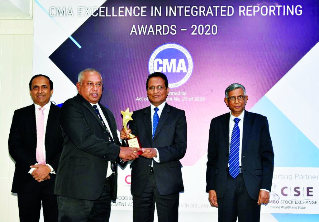 DIMO's Group CEO, Gahanath Pandithage receiving the Overall Winner award (1) (1)